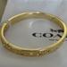 Coach Jewelry | Coach Gold Bangle Bracelet Signature Kissing | Color: Gold | Size: Os