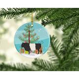 The Holiday Aisle® Belted Galloway Cow Holiday Shaped Ornament Ceramic/Porcelain in Blue/Green | 3 H x 3 W x 0.25 D in | Wayfair