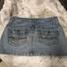 American Eagle Outfitters Skirts | Aeo Denim Distressed Mini Skirt Size 2 | Color: Blue | Size: 2