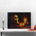 Northlight Seasonal LED Lighted Skull by Flickering Candlelight Halloween Canvas Wall Art 12" x 15.75" Canvas in Black/Orange | Wayfair 32275399