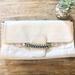 Jessica Simpson Bags | Jessica Simpson Fearless Cream Clutch With Chain Details And Strap | Color: Cream | Size: Height 7 Inches