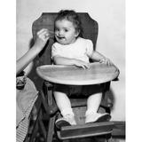 Baby feeding in high chair Poster Print (24 x 36)
