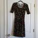 Lularoe Dresses | Guc Lularoe Nicole Swing Dress Size Xs Lady Bug | Color: Black | Size: Xs