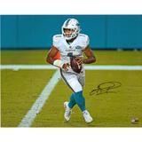 Tua Tagovailoa Miami Dolphins Autographed 16" x 20" White Jersey Rolling Out Photograph