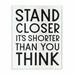 Ebern Designs 'Stand Closer Funny Bathroom Wood Texture Word Design' - Textual Art Print on Canvas Wood in Brown | 15 H x 10 W x 0.5 D in | Wayfair