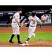 Alex Bregman Houston Astros Unsigned Bat Hand Off Photograph