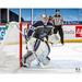 Connor Hellebuyck Winnipeg Jets Unsigned Reverse Retro Jersey In Net Photograph