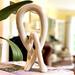 Ivy Bronx Jeffords Natural Soapstone Lovers Knot Sculpture Stone in Brown | 10 H x 4 W x 4 D in | Wayfair 35FEF5B7A5904F2E92412E79006347BF