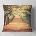 Designart 'Autumn Forest with Walking Path' Modern Forest Throw Pillow