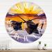 Designart 'Sunset and Two Small Boats Parking On The Shore' Lake House wall clock