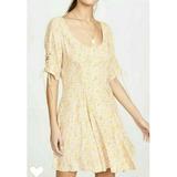 FREE PEOPLE Womens Yellow Floral Short Sleeve Scoop Neck Mini Fit + Flare Dress Size S