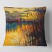Designart 'Yellow Sunset Through The High Grass By The Lake' Nautical & Coastal Printed Throw Pillow