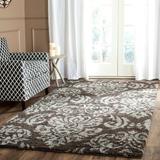 Brown 96 x 1.2 in Area Rug - Charlton Home® Schoch Floral Dark Area Rug Polypropylene | 96 W x 1.2 D in | Wayfair CDCA8FAC73484262805EB200FD49F4C1