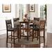 Winston Porter Jackins 4 - Person Round Solid Wood Dining Set Wood in Brown | 36.25" H x 42.25" L x 42.25" W | Wayfair