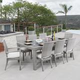 Wade Logan® Castelli Rectangular 8 - Person 83" Long Outdoor Dining Set w/ Cushions Glass/Metal | Wayfair 8274BB4E41504B099948AEF7B670B75C