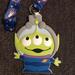 Disney Accessories | Disney Parks Pixar Toy Story Alien Id Holder | Color: Cream | Size: Os
