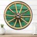 Designart 'Antique Wagon Wheel on Turquoise Wood' Farmhouse Wood Wall Clock