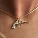 Urban Outfitters Accents | Country Gold Retro Chic Gun Pendant Neckla | Color: Gold/Pink | Size: Os