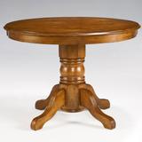 Round Pedestal Dining Table by Homestyles in Oak