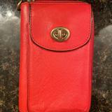 Coach Accessories | Coach Phone Wallet. Used. Good Condition. | Color: Orange/Pink | Size: Os