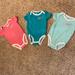 Nike One Pieces | Brand New 3 Pack Nike Baby Girl Bodysuits Size 9m (In Pink, Teal, And Mint!) | Color: Blue/Pink | Size: 9mb