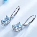 Boucles d'oreilles pendantes en topaze bleue pour dames bijoux exquis à la mode et simples