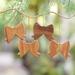 The Holiday Aisle® Eka 4 Piece Hanging Figurine Ornament Set Wood in Brown | 3.1 H x 3.9 W x 0.4 D in | Wayfair C95A6A8FB30C4A9B8440400FD3BC05E1