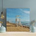 Highland Dunes Brown en Lifeguard Tower On Beach Shore During Daytime - 1 Piece Square Graphic Art Print On Wrapped Canvas in Blue/Brown | Wayfair