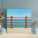 Highland Dunes Brown en Fence On Brown Sand During Daytime - 1 Piece Square Graphic Art Print On Wrapped Canvas in Blue/Brown | Wayfair