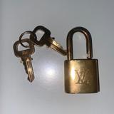 Louis Vuitton Jewelry | Louis Vuitton Authentic Engraved, Signature Padlock | Color: Gray | Size: Os