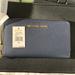 Michael Kors Bags | Michael Kors Zip Phone Wallet Nwt Price Firm | Color: Blue/Gold | Size: :7" X 3.75" X 0.75"