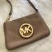 Michael Kors Bags | Michael Kors Pebbled Leather Tan Wristlet Clutch | Color: Tan | Size: 7 In. X 4.5 In.