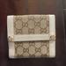 Gucci Bags | Gucci Bi-Fold Cream/Beige Monogram Wallet | Color: Cream/Tan | Size: Os