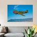 East Urban Home 'A Curtiss P-40E Warhawk' Photographic Print Canvas Canvas, Cotton in Blue | 18 H x 32 W x 1.5 D in | Wayfair