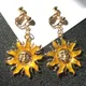 Boucles d'oreilles Sun God sans trou clips d'oreille couleur or clip soleil sur boucle d'oreille