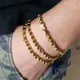 Bracelet bouddhiste fait à la main bleu fil porte-bonheur tressé femmes tibétain perles de cuivre