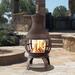 Arlmont & Co. Wood Burning Chimenea, Outdoor Round Wooden Fire Pit Fireplace Cast Iron/Iron in Black/Brown/Gray | 46 H x 22.5 W x 22.5 D in | Wayfair