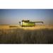 Paplow Harvesting Company custom combines a wheat field near Ray; North Dakota United States of America Poster Print (38 x 24)