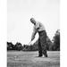 Mature man playing golf on a golf course Poster Print (18 x 24)