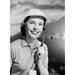 Smiling women with golf club Poster Print (24 x 36)