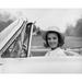 Portrait of young woman sitting in car smiling Poster Print (24 x 36)