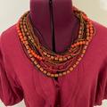 Anthropologie Jewelry | Anthropologie Fall Layering Necklace Wood And Glass Beads Rust Orange And Gold | Color: Gold/Orange | Size: Os