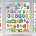 The Holiday Aisle® Easter Eggs Flowers Double-Sided Window Decal in Green/Yellow | 11.8 H x 7.8 W in | Wayfair 82657B48A6CE40D9840E8CB5DCE1F492