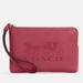 Coach Bags | Coach Corner Zip Wristlet With Embossed Horse And Carriage | Color: Gold/Red | Size: 6 1/4" (L) X 4" (H) X 1/2" (W)