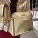 Michael Kors Bags | Michael Kors Jet Set Medium Logo Dome Satchel Pale Gold Xcross Xbody | Color: Gold | Size: Medium