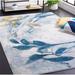 Blue/White 90 x 61 x 0.24 in Indoor Area Rug - Ivy Bronx Alradius Machine Made Power Loom Polypropylene Area Rug in Beige/Blue | Wayfair