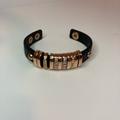 Jessica Simpson Jewelry | Jessica Simpson Rose Gold And Leather Cuff Bracelet | Color: Black/Gold | Size: Adjustable