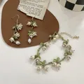 Muguet avec perle verte pour femme boucles d'oreilles longues bracelet crochet d'oreille bijoux