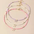 Colliers de perles de document de bonbons pour femmes tour de cou papillon blanc rose violet