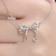 Collier pendentif à nœud papillon en cristal coréen pour femmes mignon et brillant ras du cou